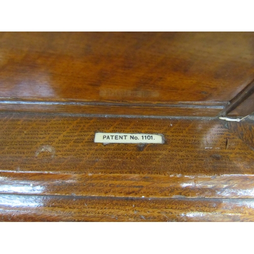 7508 - An early 20th Century honey oak collector’s chest / cutlery canteen, the twin panelled doors opening... 