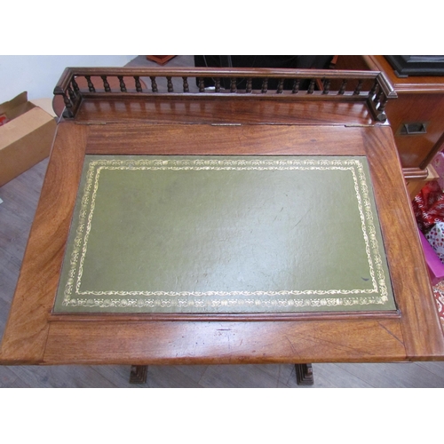 7510 - A circa 1900 shipping clerk’s desk, spindle gallery back, green tooled leather sloped surface with l... 