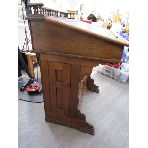 7510 - A circa 1900 shipping clerk’s desk, spindle gallery back, green tooled leather sloped surface with l... 