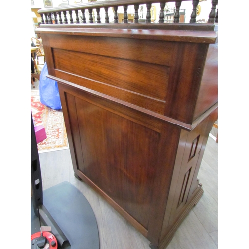 7510 - A circa 1900 shipping clerk’s desk, spindle gallery back, green tooled leather sloped surface with l... 