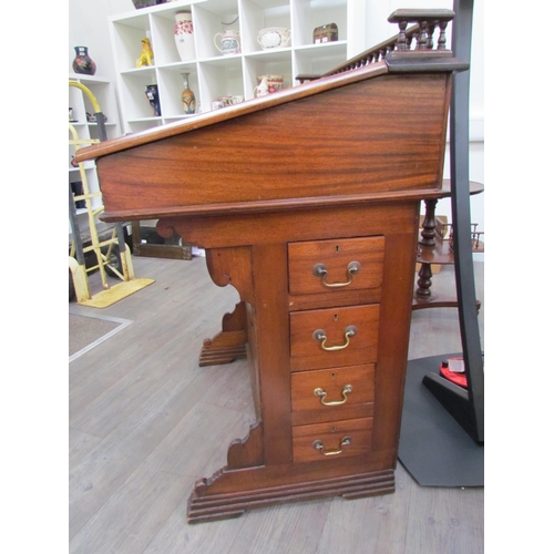 7510 - A circa 1900 shipping clerk’s desk, spindle gallery back, green tooled leather sloped surface with l... 