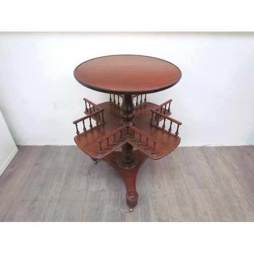 7512 - A mahogany revolving library / book table with galleried spindled shelving