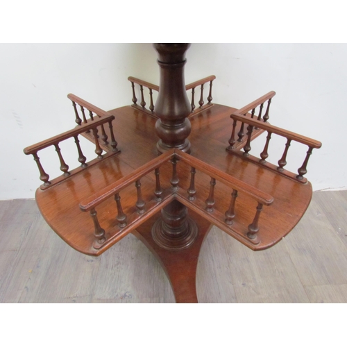 7512 - A mahogany revolving library / book table with galleried spindled shelving