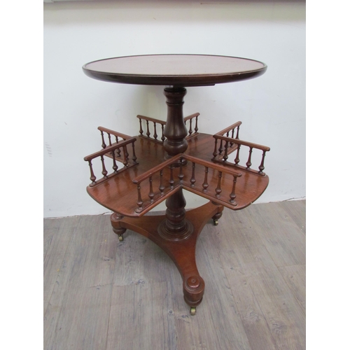 7512 - A mahogany revolving library / book table with galleried spindled shelving