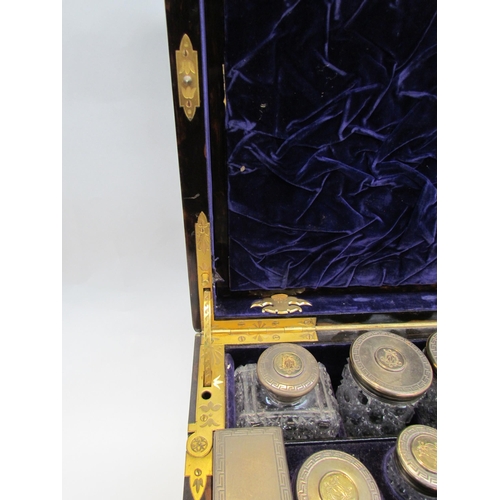 7649 - A 19th Century coromandel travelling vanity box fitted with silver lidded cut crystal glass containe... 