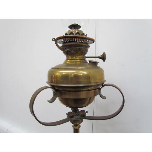 7653 - A Victorian brass extendable height standard oil lamp with copper decoration   (R) £60