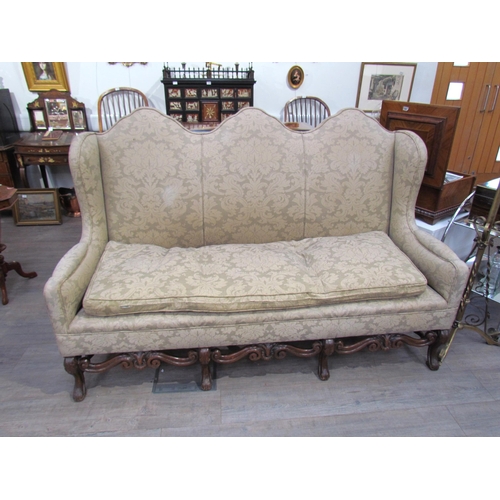 7654 - A Georgian style triple hump back sofa, oak frame, foliate design upholstery