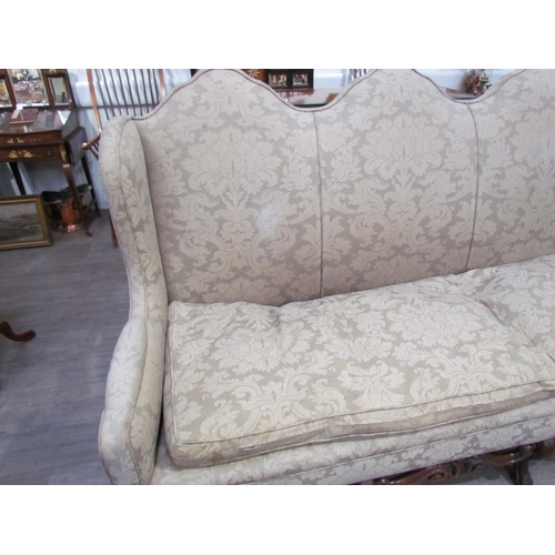 7654 - A Georgian style triple hump back sofa, oak frame, foliate design upholstery