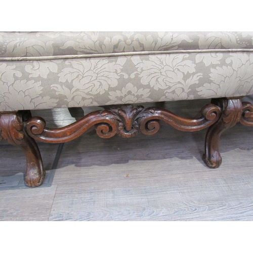 7654 - A Georgian style triple hump back sofa, oak frame, foliate design upholstery