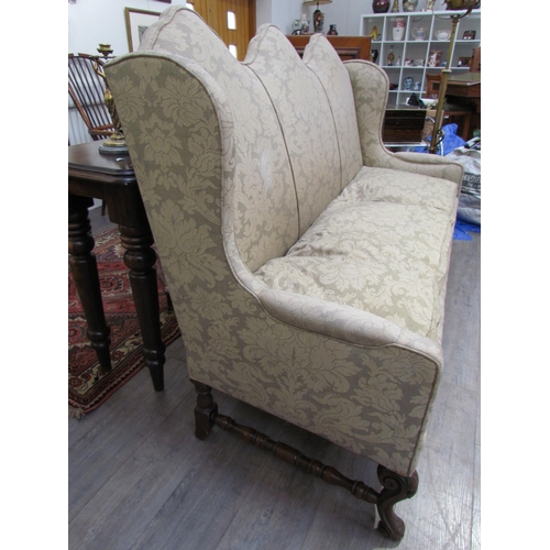 7654 - A Georgian style triple hump back sofa, oak frame, foliate design upholstery