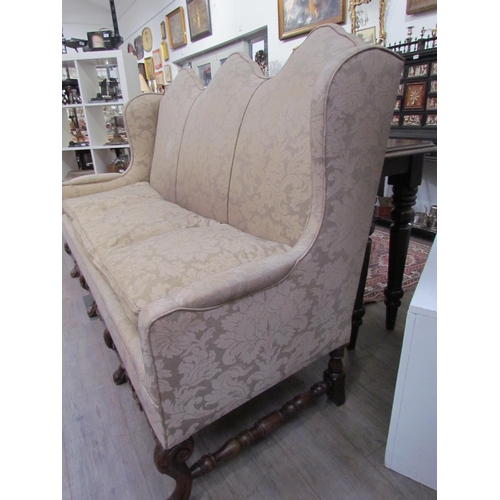 7654 - A Georgian style triple hump back sofa, oak frame, foliate design upholstery