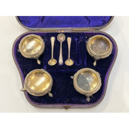 7351 - Four Martin Hall and Co silver salts in fitted case with three silver salt spoons, London 1874, 126g