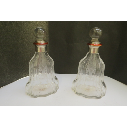 7346A - A pair of etched glass bottles with guilloche band in deep amber, glass stoppers, within a fitted El... 