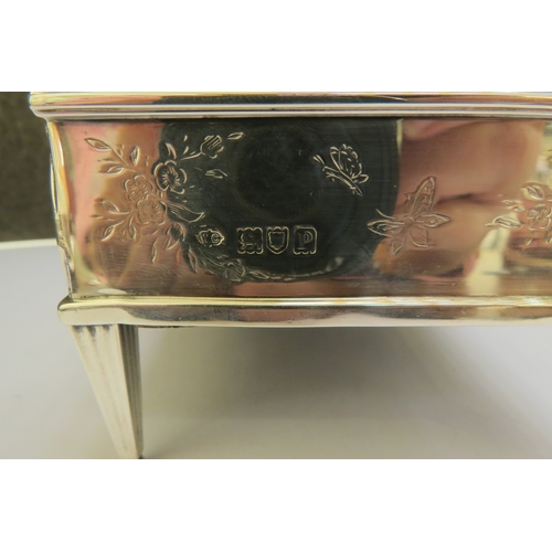 7361 - A William Comyns & Sons silver casket, domed top with twin hinged lids, swag detail, raised on feet,... 