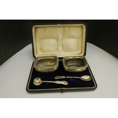 7368 - A pair of silver salts, makers mark M.J, London 1896 and 1897, in fitted case, 70g with two plated s... 