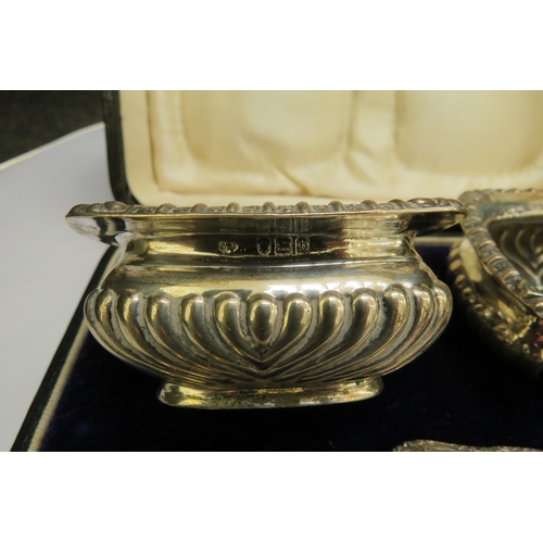 7368 - A pair of silver salts, makers mark M.J, London 1896 and 1897, in fitted case, 70g with two plated s... 