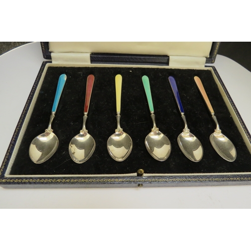 7371 - A Cohen & Charles set of six silver and enamel coffee spoons with different coloured handles (one wi... 