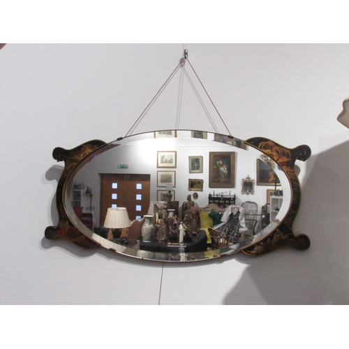 7746 - An oval bevel edge wall mirror with chinoiserie flanked ends, 78cm long   (E) £30-50