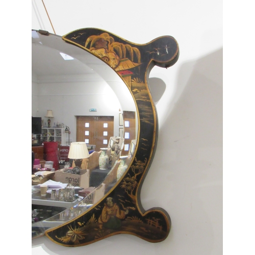 7746 - An oval bevel edge wall mirror with chinoiserie flanked ends, 78cm long   (E) £30-50