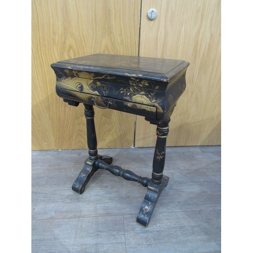 7752A - A 19th Century chinoiserie lacquer sewing table decorated with birds, foliage on turned column legs