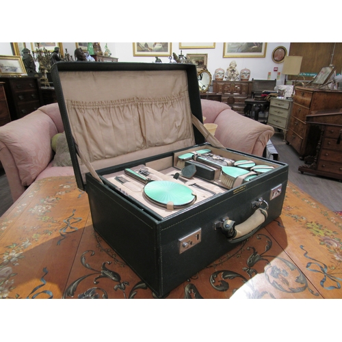 7755 - A Mappin & Webb silver and jade green guilloche vanity set within a fitted case, London 1947