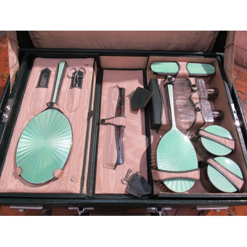 7755 - A Mappin & Webb silver and jade green guilloche vanity set within a fitted case, London 1947