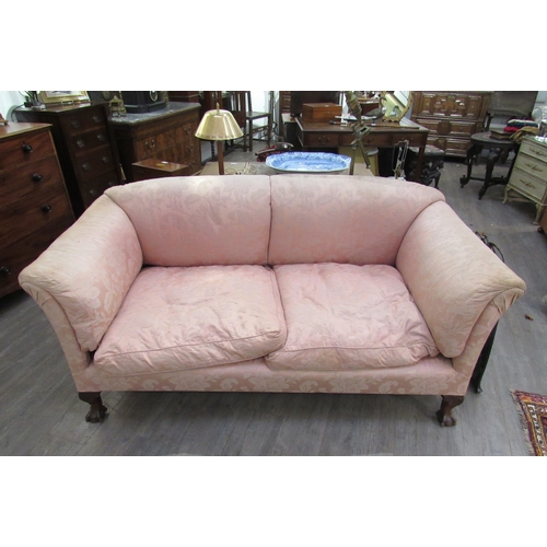 7760 - A Howard & Sons sofa on claw and ball feet, rear legs stamped, 84cm wide