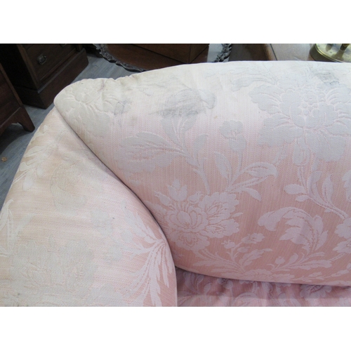 7760 - A Howard & Sons sofa on claw and ball feet, rear legs stamped, 84cm wide