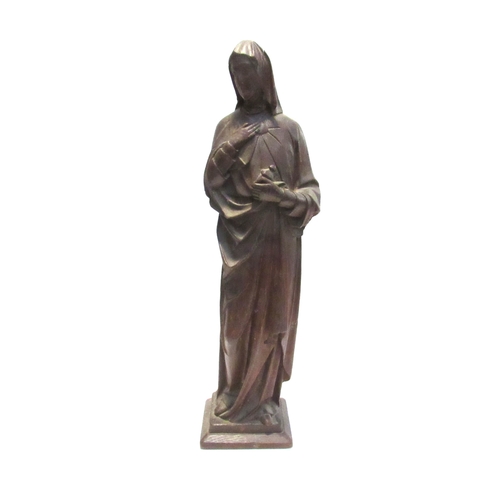 7792 - A 19th Century carved oak figure of a nun, standing 56cm high