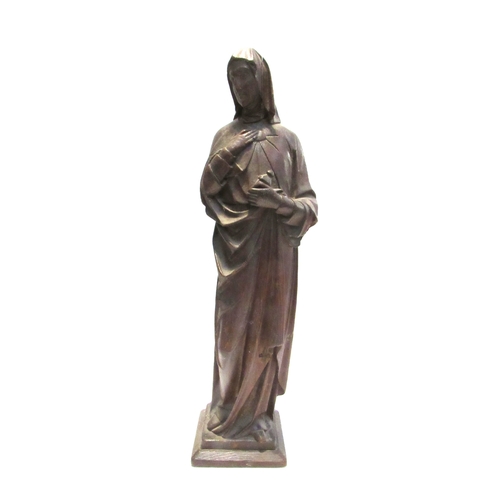 7792 - A 19th Century carved oak figure of a nun, standing 56cm high