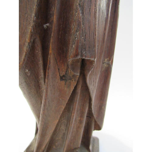 7792 - A 19th Century carved oak figure of a nun, standing 56cm high