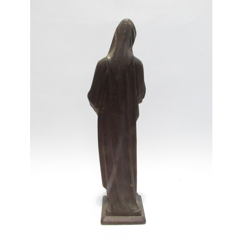 7792 - A 19th Century carved oak figure of a nun, standing 56cm high