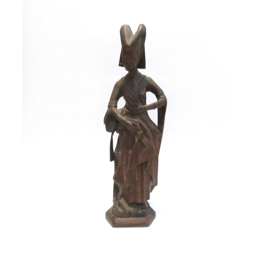 7792A - A 19th Century oak carved sculpture of a Pleurant / weeper, 61cm high