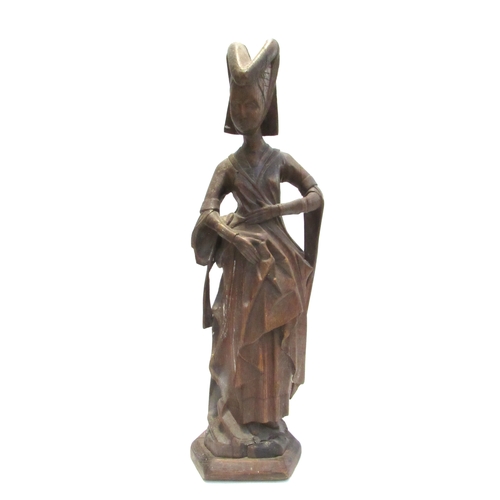 7792A - A 19th Century oak carved sculpture of a Pleurant / weeper, 61cm high