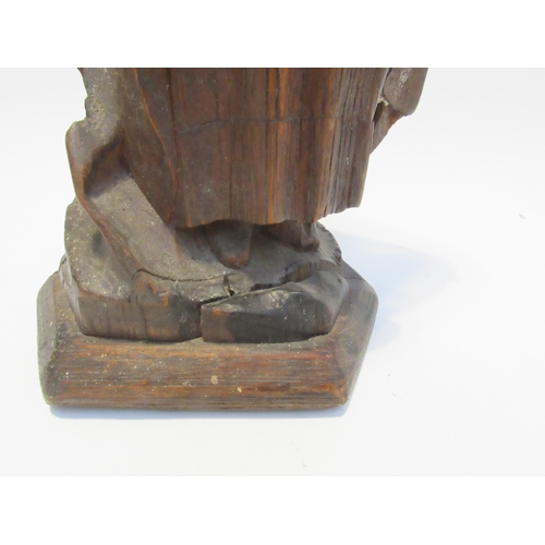 7792A - A 19th Century oak carved sculpture of a Pleurant / weeper, 61cm high