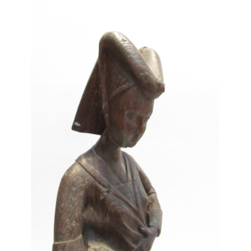 7792A - A 19th Century oak carved sculpture of a Pleurant / weeper, 61cm high