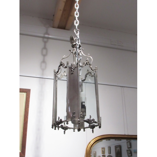 7814 - A hall lantern of large proportions with glass and chrome/silvered panels, four bulb, 67cm tall