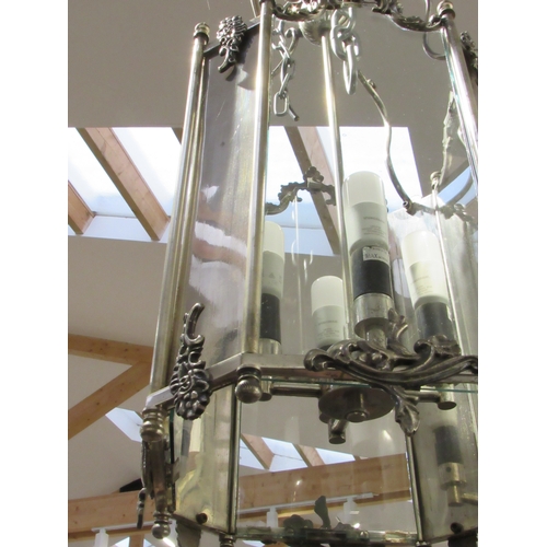 7814 - A hall lantern of large proportions with glass and chrome/silvered panels, four bulb, 67cm tall