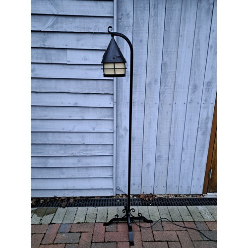 7582 - A wrought iron standard lamp as a tavern lantern