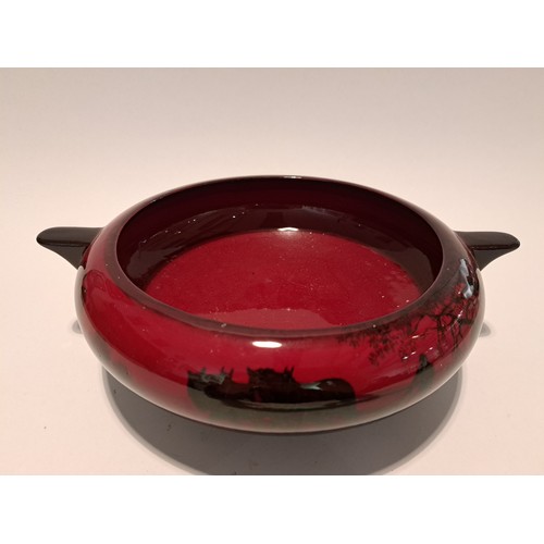 7530 - A Royal Doulton flambé twin handled shallow form bowl, 26cm diameter