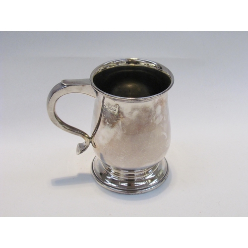 7416 - A silver tankard, plain form with stepped base, Birmingham 1946, maker's name rubbed, 345g