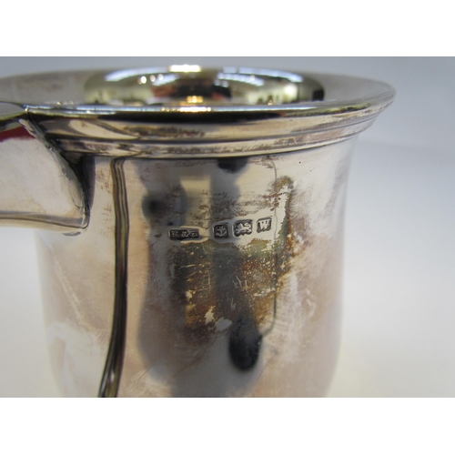 7416 - A silver tankard, plain form with stepped base, Birmingham 1946, maker's name rubbed, 345g