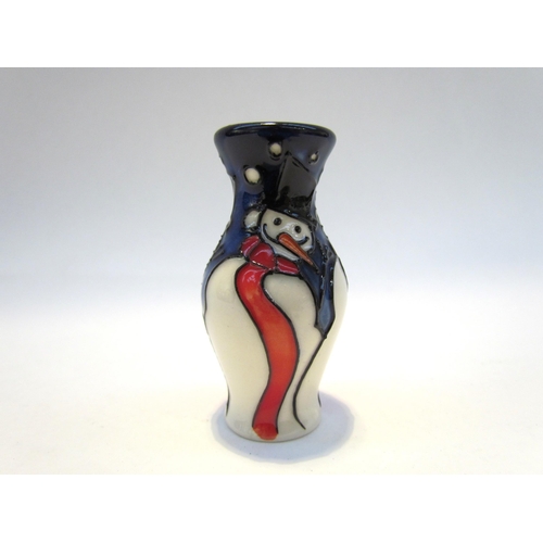 7425 - A Moorcroft miniature Snowman pattern vase, 5.5cm tall  (R)  COLLECTED