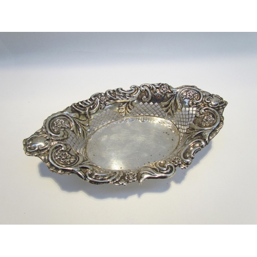 7430 - A George Nathan and Ridley Hayes silver pierced and embossed oval basket, scroll and floral decorati... 