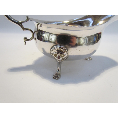 7432 - A Haseler Brothers (Edward John Haseler & Noble Haseler) silver sauce boat, scrolled handle, lion ma... 