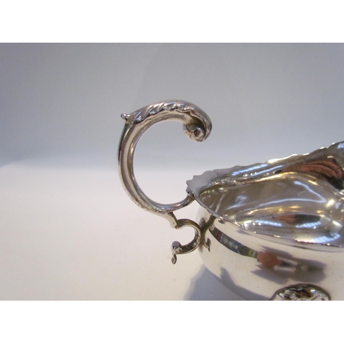 7432 - A Haseler Brothers (Edward John Haseler & Noble Haseler) silver sauce boat, scrolled handle, lion ma... 