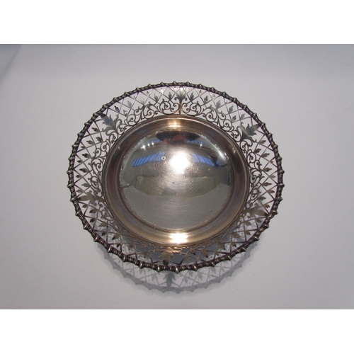 7443 - A James Dixon & Sons silver pierced bowl on three feet, Sheffield 1915, 8.5cm tall x 20cm diameter, ... 