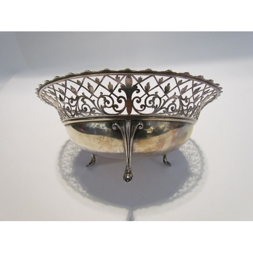 7443 - A James Dixon & Sons silver pierced bowl on three feet, Sheffield 1915, 8.5cm tall x 20cm diameter, ... 