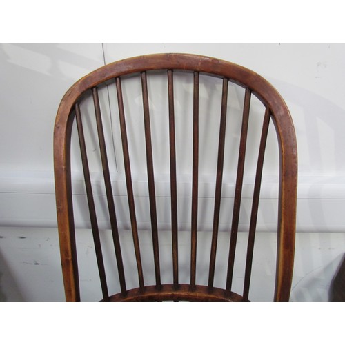 7591 - A pair of circa 1800 his and hers Windsor chairs, the hoop and stick-back over a solid elm seat, on ... 