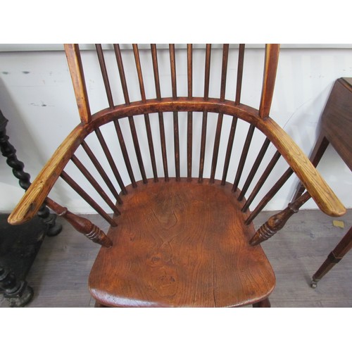 7591 - A pair of circa 1800 his and hers Windsor chairs, the hoop and stick-back over a solid elm seat, on ... 